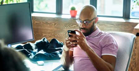 Man using facial recognition on a mobile device