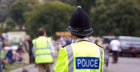 Police man looking over an event