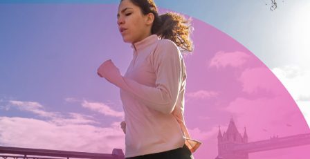 Woman running alongside a river