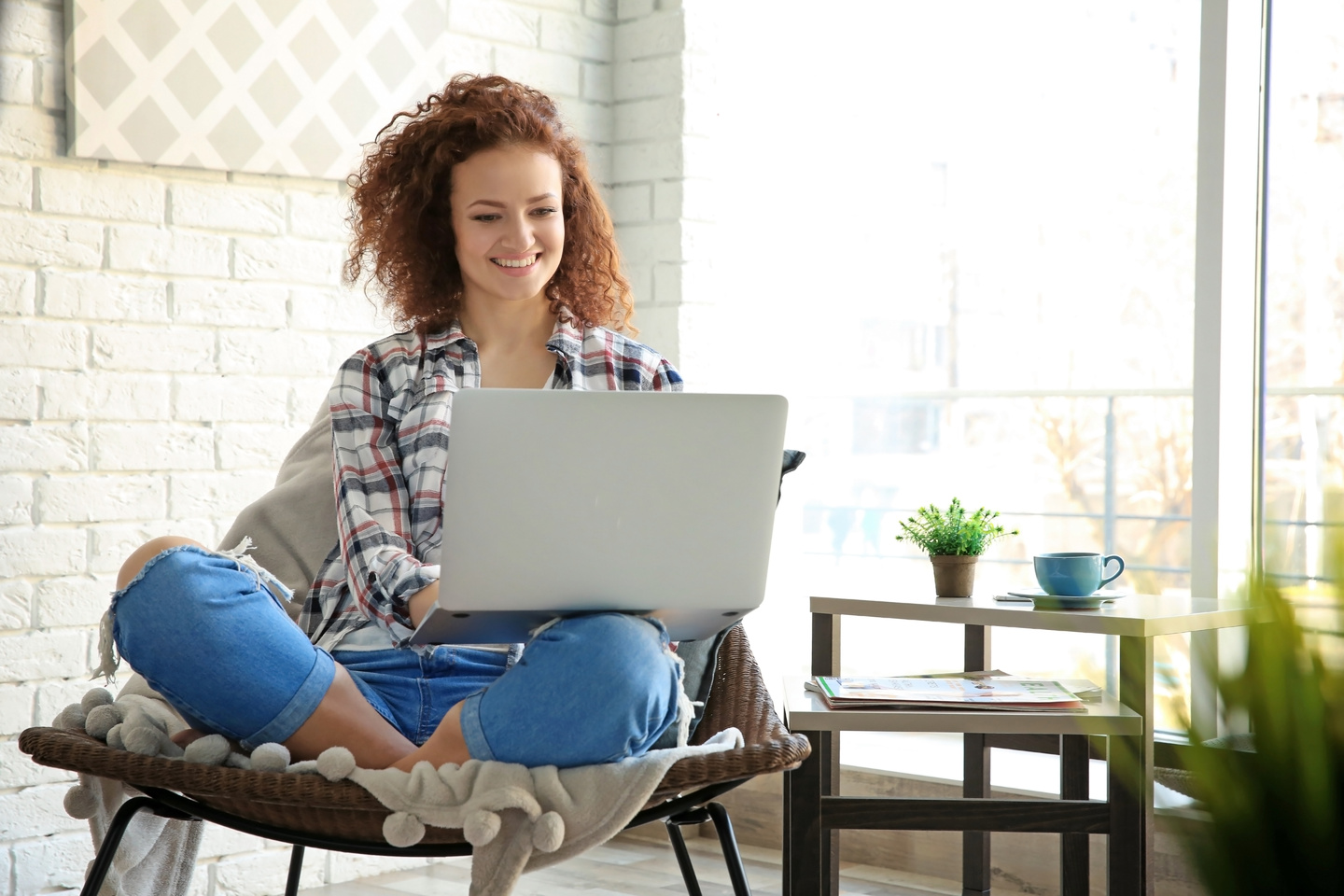 Young woman using laptop at home