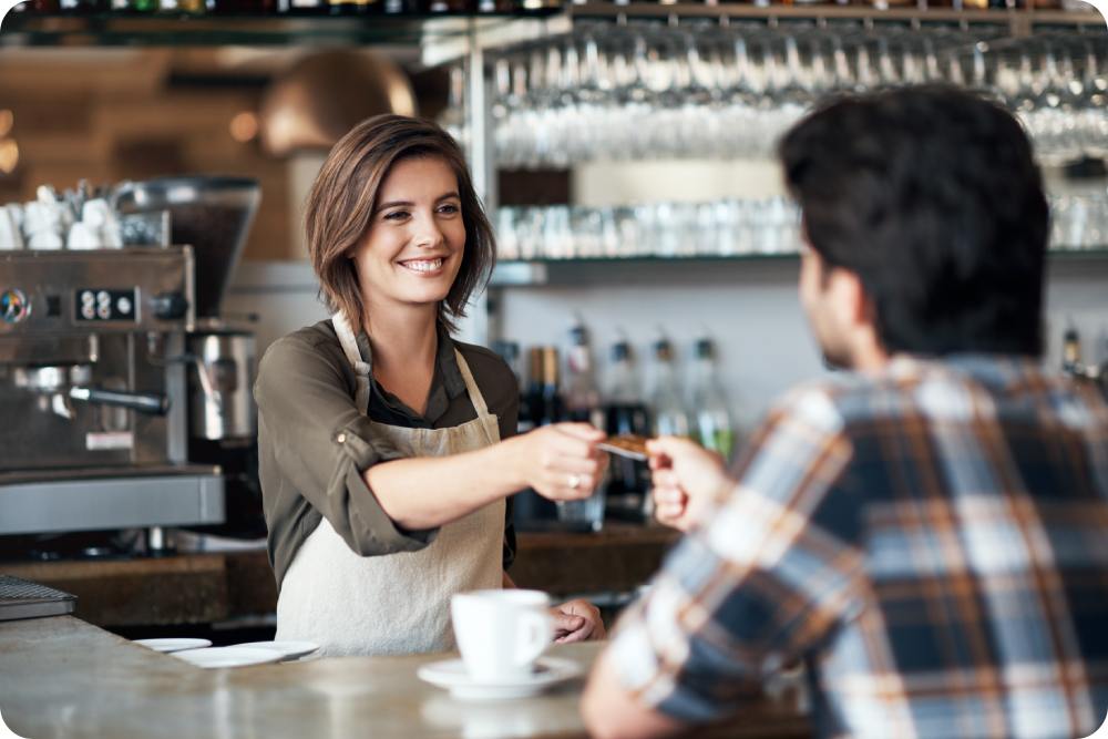 Man purchasing a coffee using a credit card